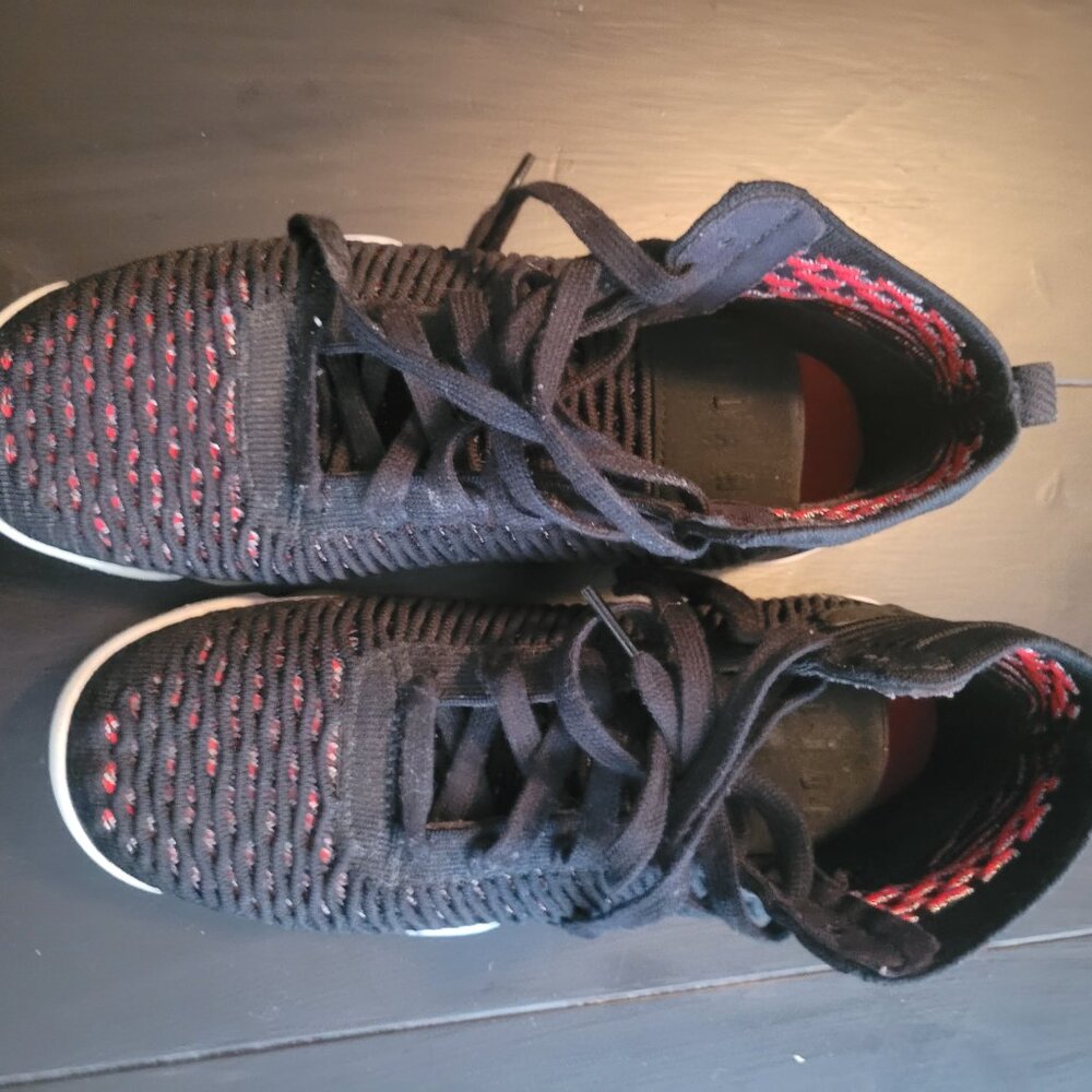 Nike Air Jordan Flyknit Elevation 23 sneakers in the black and University Red